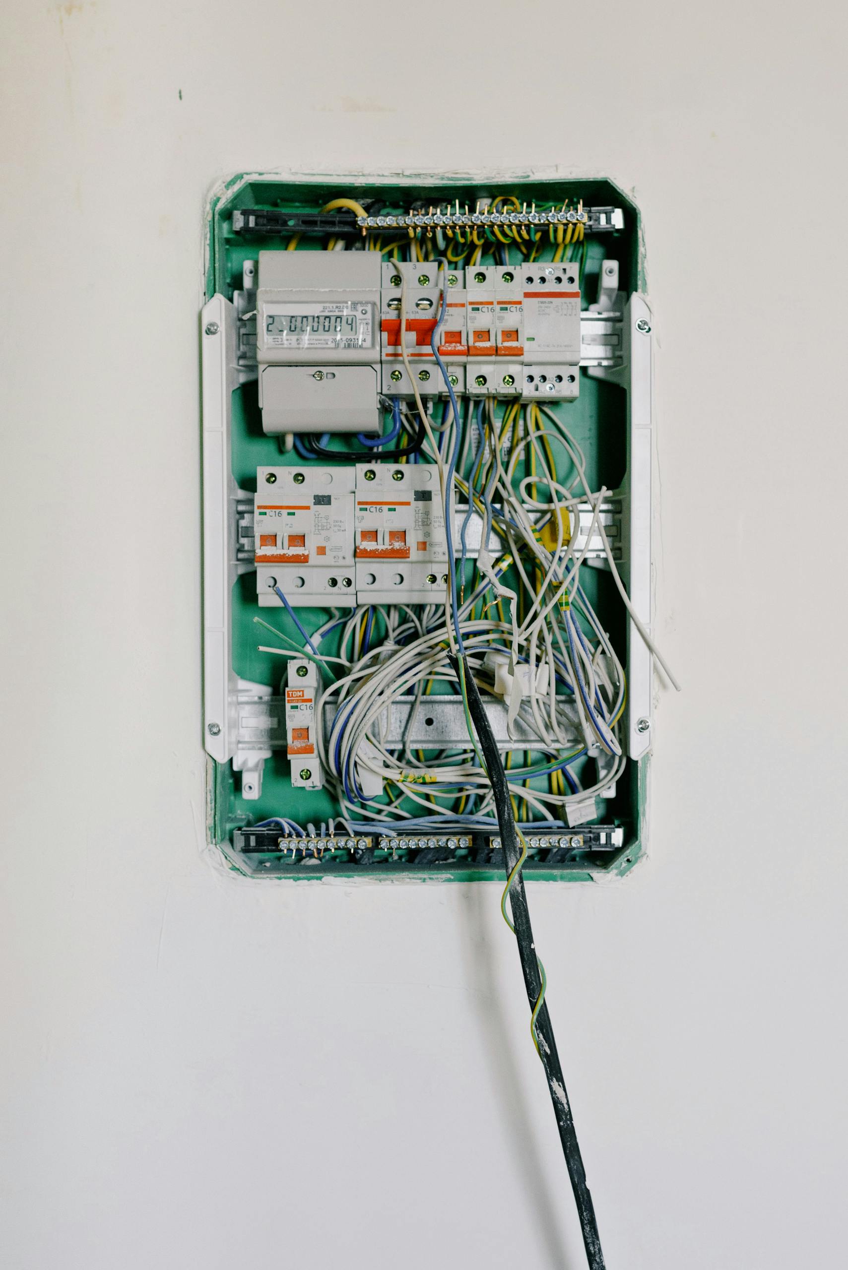 Old Home Detailed View Of An Open Electrical Circuit Box With Complex Wiring And Circuit Breakers 5767595 Scaled 1