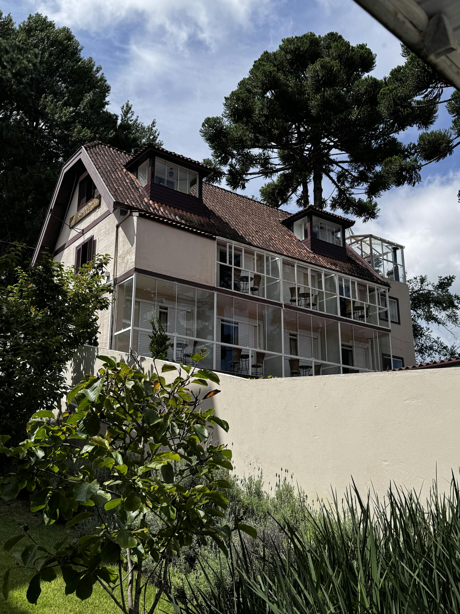 Old Home Quaint European Style House With Glass Windows Set In A Lush Garden Under A Blue Sky 33690141 Scaled 1